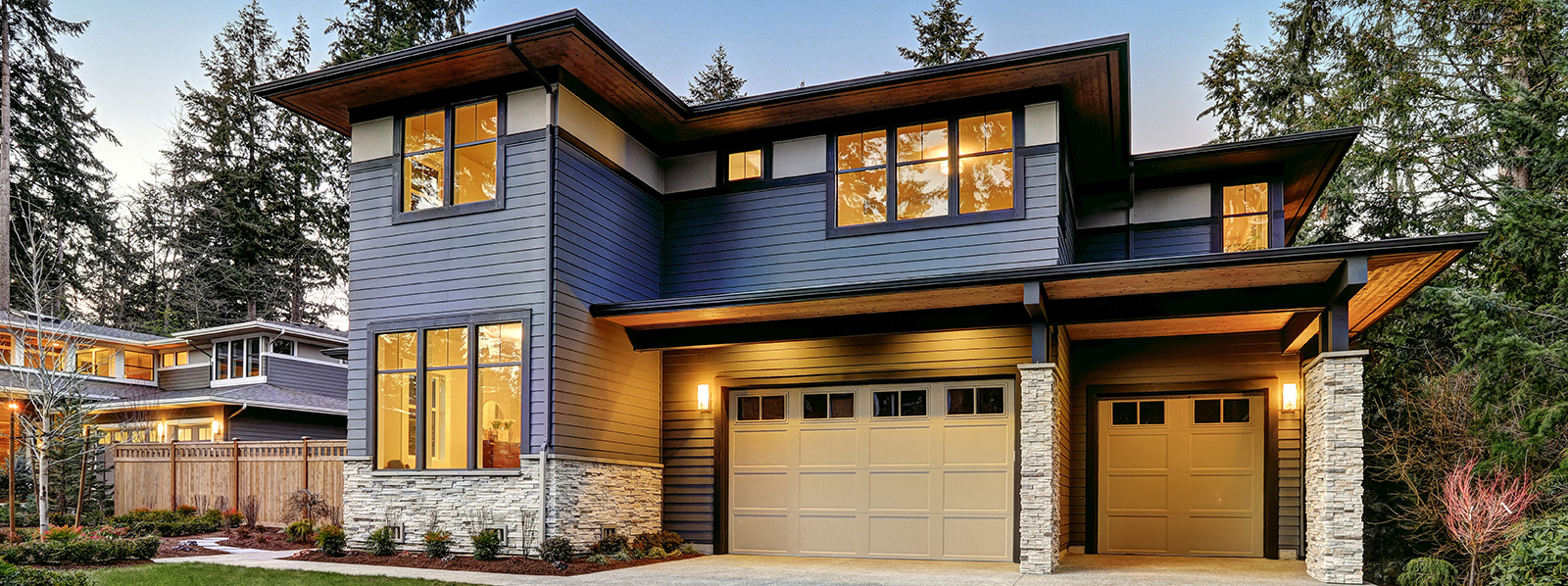 beautiful home with standard and mini garage doors