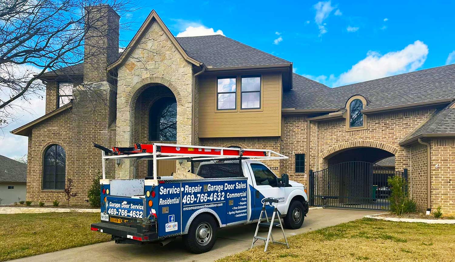 Encompass Garage Door Repair Truck in Front of House