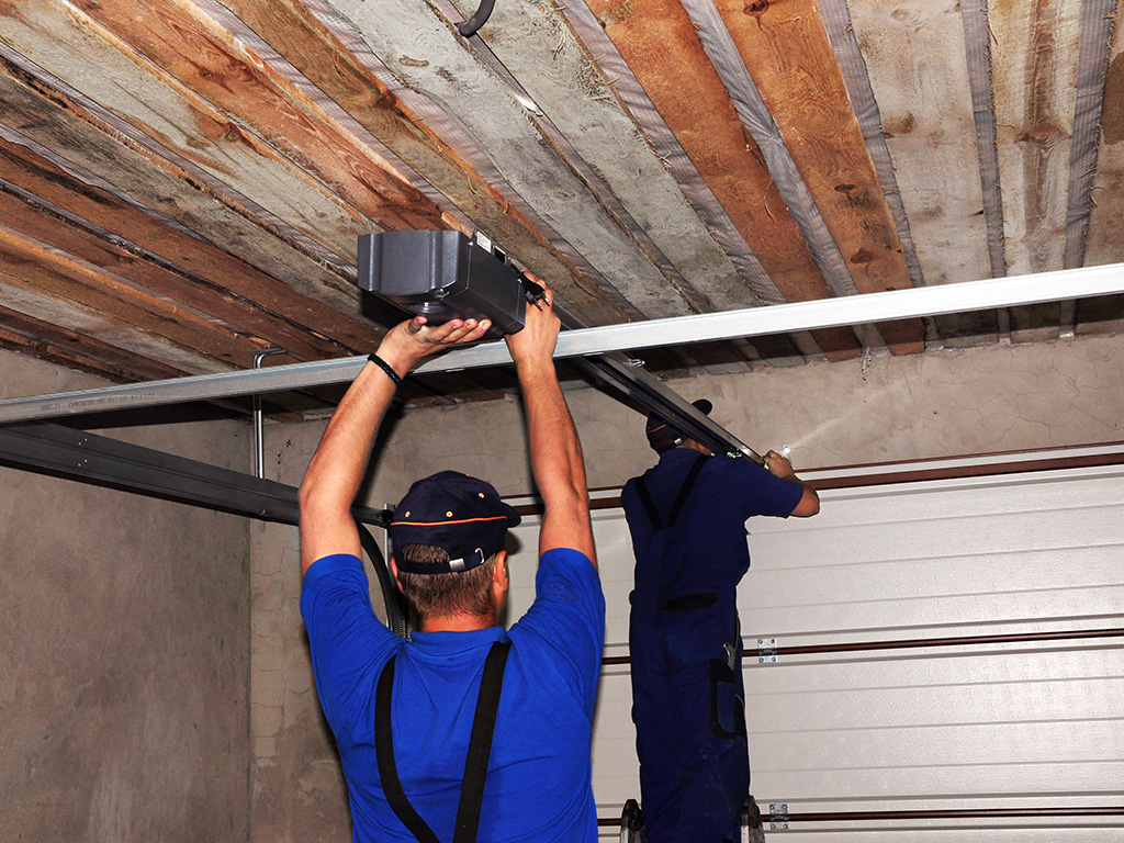 Two Technicians Performing Garage Door Installation