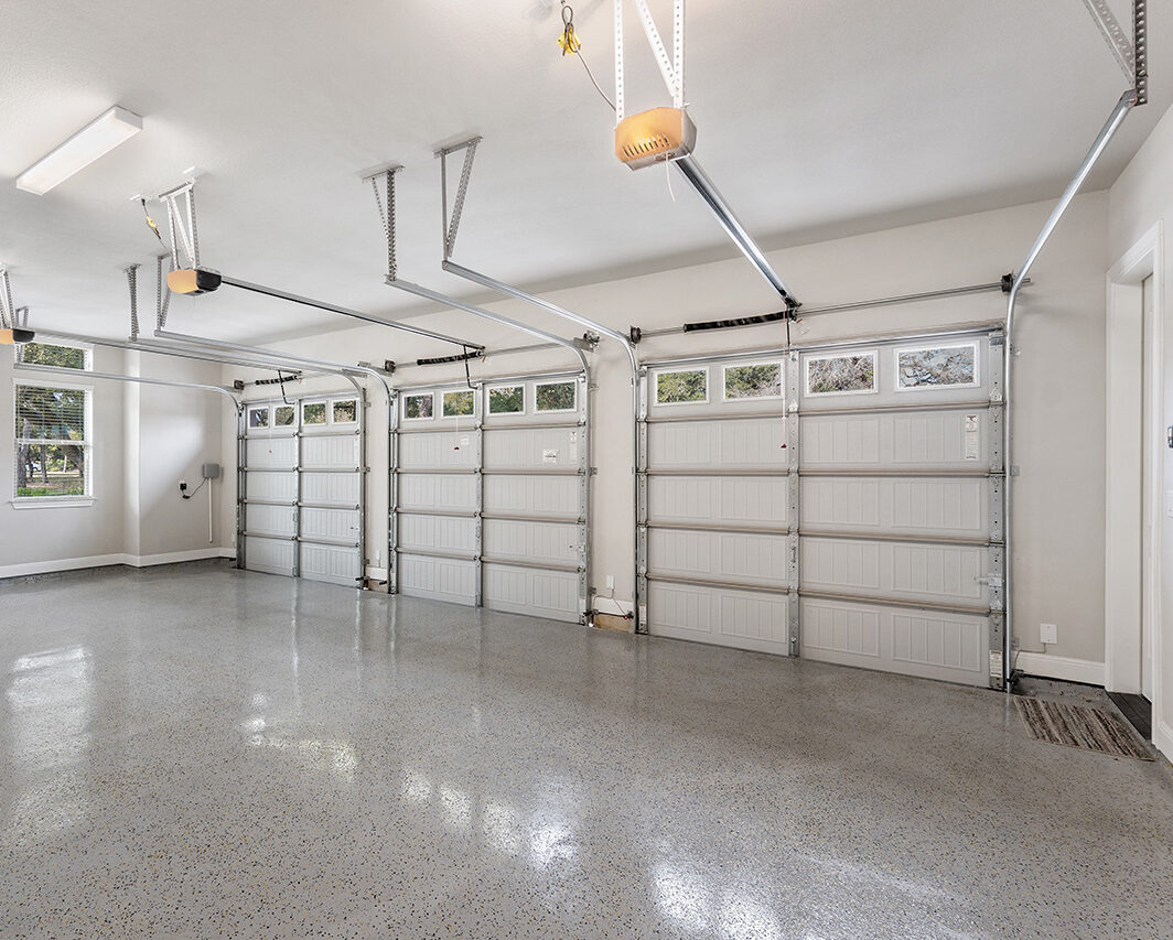 Spacious Garage with Multiple Overhead Doors Ready for Installation