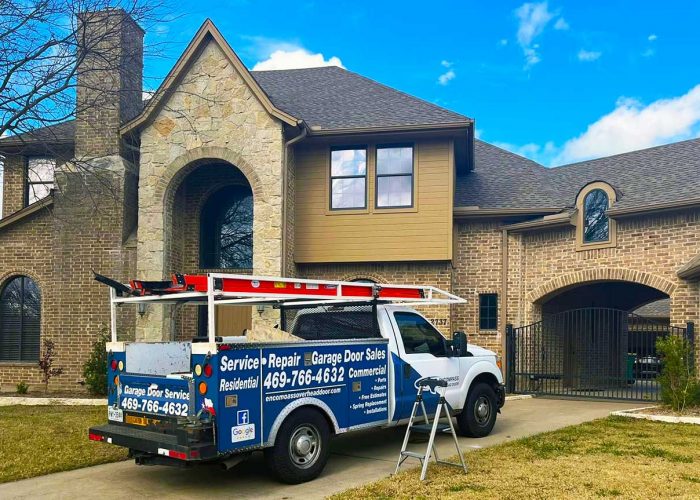 Encompass Garage Door Repair Truck in Front of House